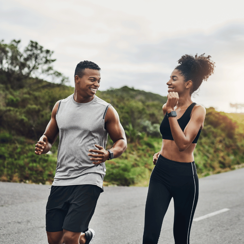 A happy couple jogging outdoors, symbolizing the energy-boosting and stamina-enhancing effects of Ashwagandha, featured on Zaira Natural.