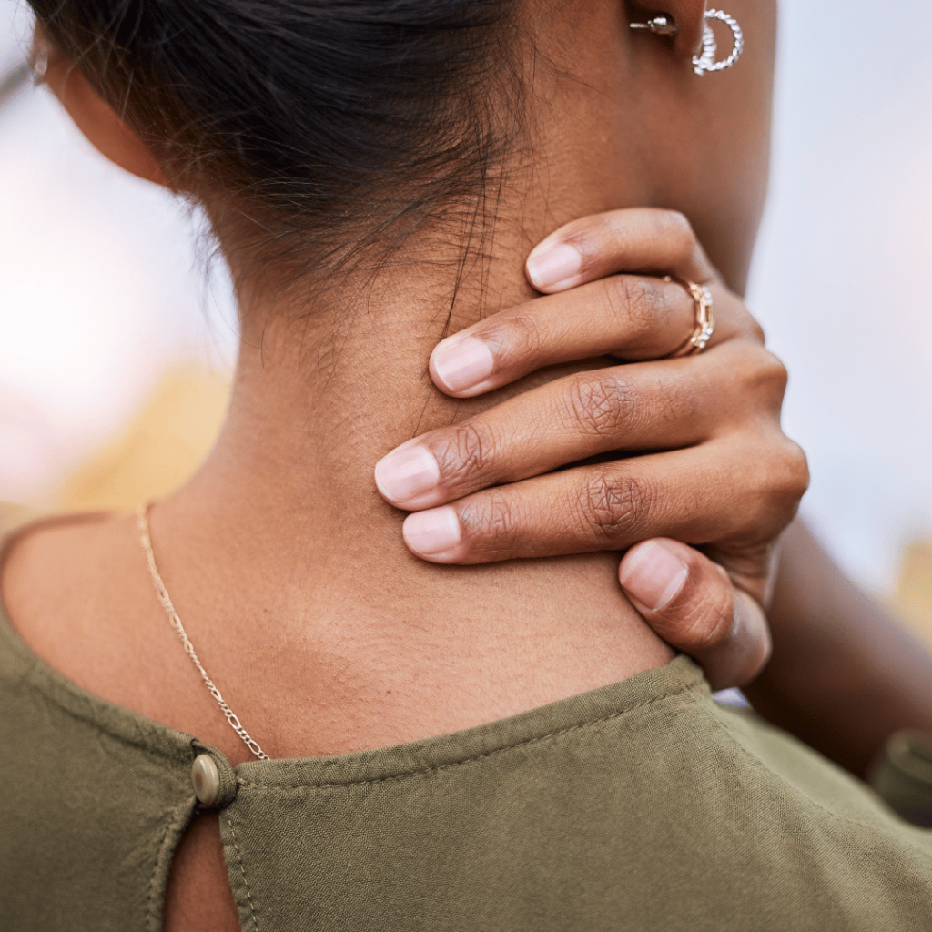 Close-up of a woman holding her neck, symbolizing relief from inflammation and oxidative stress with sage.